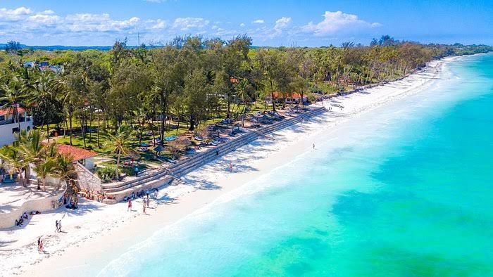 Aerial view of Diani Beach's white sand and turquoise waters