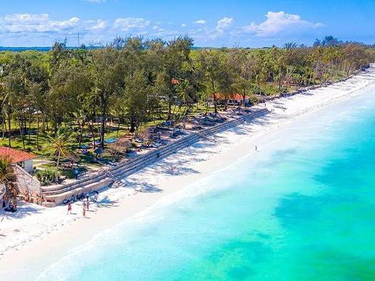 Aerial view of Diani Beach's white sand and turquoise waters