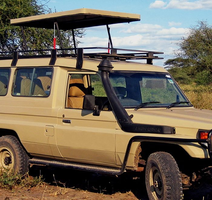 5-seat 4x4 safari Land Cruiser with pop-up roof, close-up view