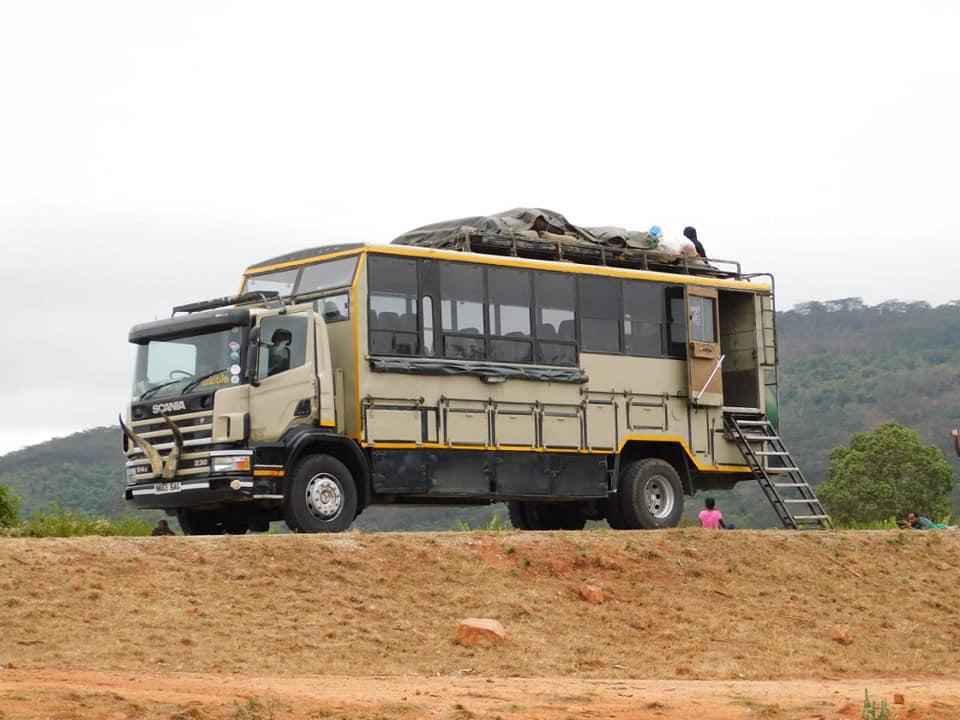 Large Scania overland expedition truck with raised seating for multi-day camping safaris