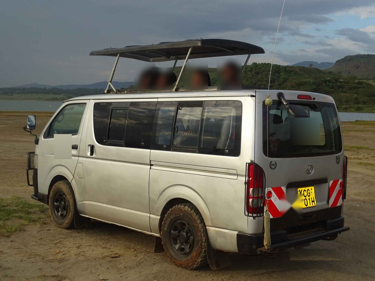 Silver 8-seat safari van with pop-up roof for game viewing